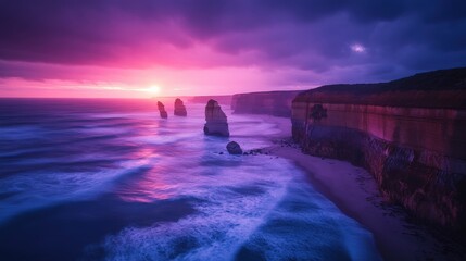 The sun sets over a dramatic coastline, casting vibrant purples and pinks across the sky. Waves crash against cliffs, creating a serene yet powerful atmosphere at dusk