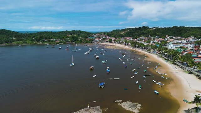 Aerial view of boats moored on the coastline of Itacare, sunny day in Brazil