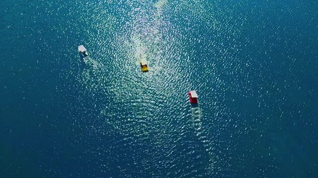 Tourists paddling pedal boats on Lake Kournas