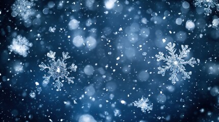 A winter scene with falling snowflakes on a dark blue background, creating a festive atmosphere.