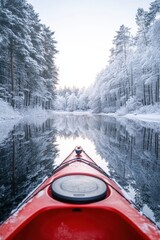 Kayak boat in still quiet lake water with snow ice forest in winter