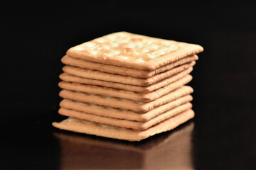 cracker, flour biscuit healthy food snack isolated on black background with space for text
