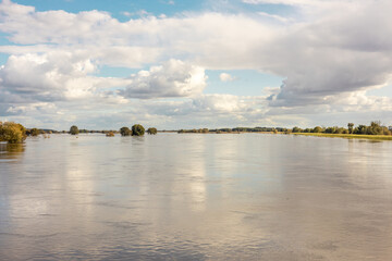 Landscape of the picturesquely spread Odra River on the Polish-German border. Concept. Threat and beauty of nature