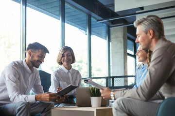 Business meeting - manager discussing work with his colleagues.
