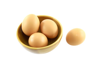 3 fresh eggs in a cup and 1 on the floor isolated on transparent background.