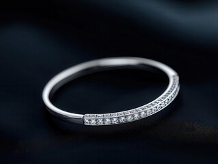 Isolated view of a diamond bangle bracelet with a sleek, curved design and sparkling diamonds, bracelet, diamond, bangle, curved
