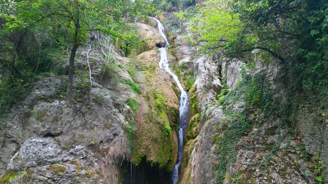 Drone view at Hotnishki Waterfall near Veliko Tarnovo during summer with great acqua colors