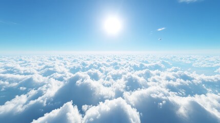 Fototapeta premium A bright skyscape above scattered clouds, with a vivid blue sky and a tiny bright sun
