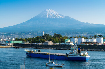 Japan industrial factory area with Fuji mountain and blue sky background view from Fishing port,...