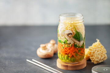 Healthy homemade instant noodles with vegetables in mason jar. Asian  vegetarian lunch idea. To-Go Miso Noodle Soup