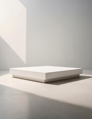 White pedestal for product display on a light-colored background