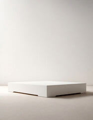 White rectangular pedestal for product display - on a light-colored table