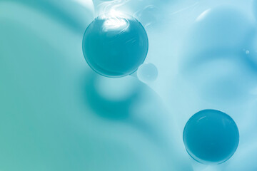 Oil drop background on blue water surface It is natural and abstract.