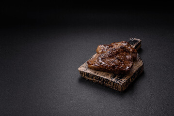 Juicy beef steak grilled with salt, spices and herbs