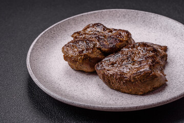 Juicy beef steak grilled with salt, spices and herbs