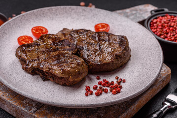 Juicy beef steak grilled with salt, spices and herbs