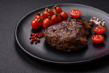 Juicy beef steak grilled with salt, spices and herbs