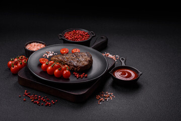 Juicy beef steak grilled with salt, spices and herbs