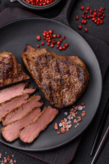 Juicy beef steak grilled with salt, spices and herbs