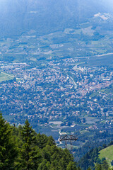 Aerial view of Italian City of Meran with Etsch Valley and Etsch River seen from mountain resort...