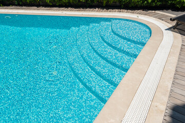A swimming pool among green trees