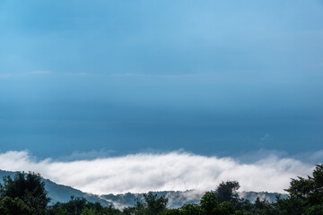 Silhouette of the Taipei city under the sun after a rainy day, a quiet city surrounded by clouds and mist, creating a dramatic and transcendent atmosphere. Taiwan.