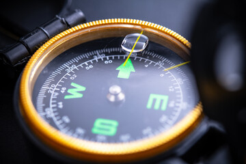 High-Detail Close-Up of a Compass, Perfect for Adventure Travel Themes, Navigation, Camping, and Outdoor Exploration, Highlighting Precision and Direction.