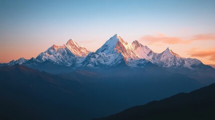 Fototapeta premium As the sun sets, the mountain range is bathed in warm hues of orange and pink, creating a serene and breathtaking view that captivates nature lovers and adventurers alike