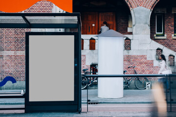Public transport station billboard with blank copy space screen for advertising text message,promotional content, empty mock up Lightbox for information, stop clear poster display in urban city street © BullRun