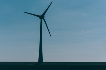 Metallic huge windmill proving clean ecological alternative power from nature. Alternative electricity generation