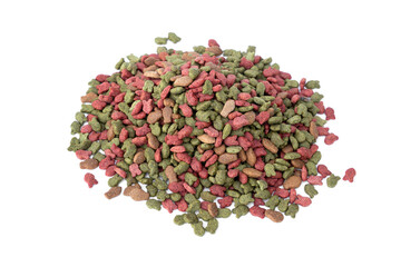Pet treats with contains essential flavors and nutrients. Cat crunchy biscuits. Pile of dry cat food pellets come in fish shapes with colors green red brown isolated on white background.
