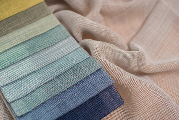 Light linen fabric in pastel blue colors. Fabric samples for curtains and tulles.