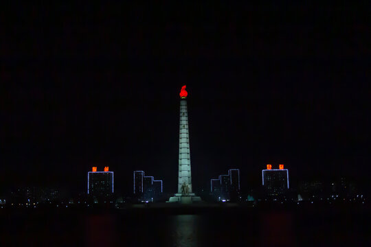 Night view at Juche tower in Pyongyang, North Korea. This 170 m high monument was opened in1982.