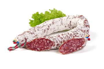 Traditional Spanish Fuet thin dried sausage with slices, Close-up, isolated on a white background.