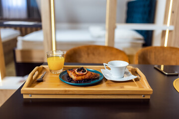 Closeup of the pie that is served with coffee and orange juice for a dessert.
