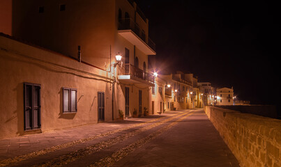 Buildings in Alghero seafront at night