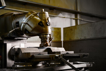 Vintage vertical turning mill used make detail in workshop