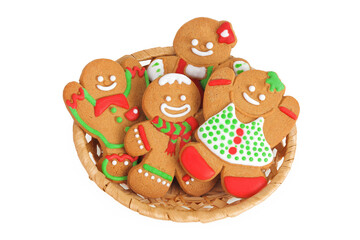 christmas gingerbread cookie in a wicker basket isolated on white background