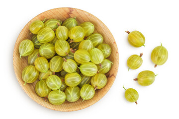 Green gooseberry in a wooden bowl isolated on white background . Top view. Flat lay.