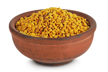 Bee pollen grains in ceramic bowl isolated on white background