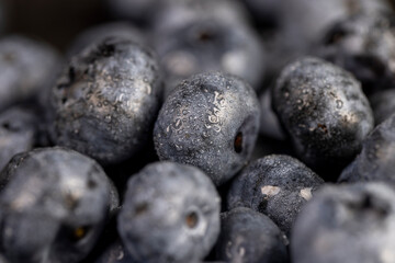 a pile of blueberries scattered on the board