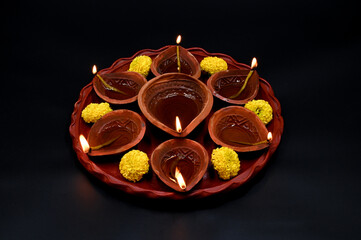 PRADIP THALI ON ISOLATED BLACK BACKGROUND.