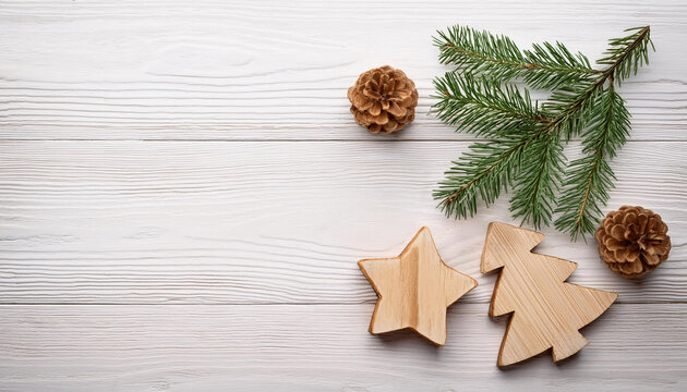 Wooden Christmas Ornaments with Pine Cones and Evergreen Branch on White Wooden Background for Festive Decor
