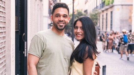 Happy couple standing together in city during daytime