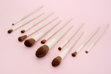 Flat lay composition with professional makeup brushes. Make-up artist kit