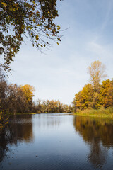 Silence and tranquility in the autumn landscape on the lake, the mirror surface of the water,...
