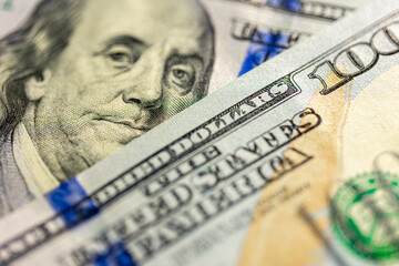 Close-up image of Benjamin Franklin on 100 bill. Finance concept.