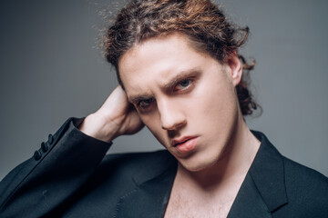 Portrait of the handsome man. Young guy model headshot. Male face. Young handsome man. Confident male model. Man looking proud. Closeup face of attractive man. Elegant guy.