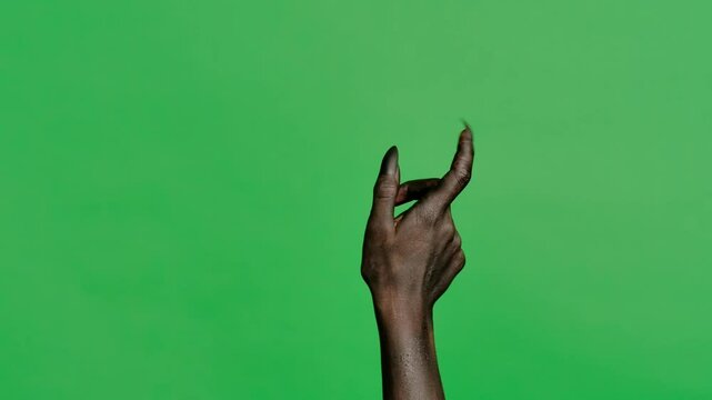 Creepy halloween devil monster hand in black paint with nails clicking and swiping, isolated on chroma key green screen background, workspace mockup.