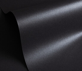 Black paper with a textured surface and minimalist, monochrome background. The premium structure...